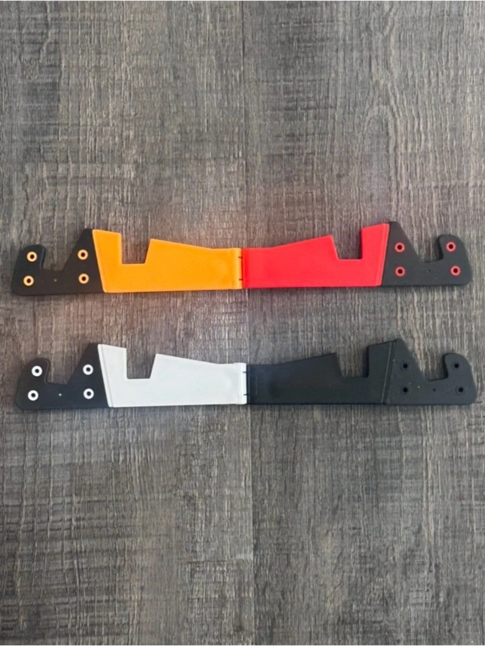 New Pack of 4 Universal Folding Phone Stands in Black, White, Red & Orange